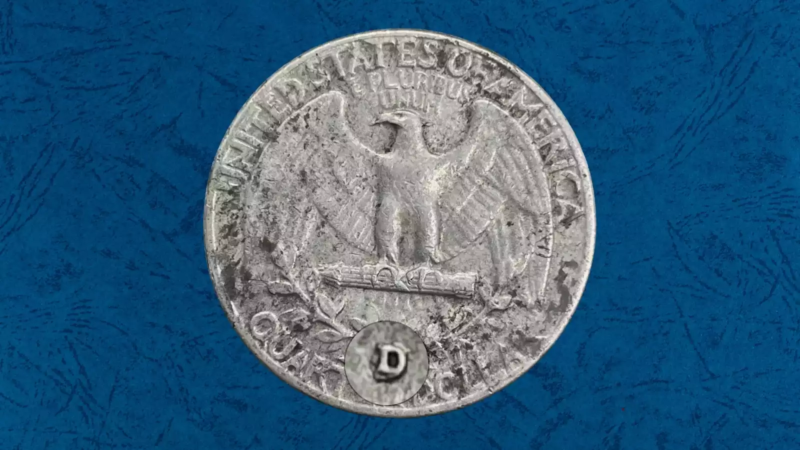 1957-D quarter reverse extreme macro showing repunched mint mark with doubled D shadow visible under magnification